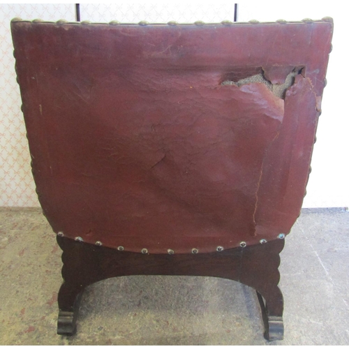 2566 - 1930s oak X framed fireside chair with hide upholstered seats and back