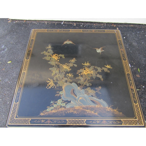 2574 - A Chinese black lacquered square cut occasional table, the top decorated with birds, chrysanthemums ... 