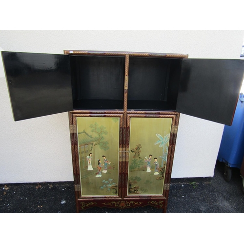 2578 - A Chinese lacquered hanging cupboard enclosed by two panelled doors, with overlay repeating gold det... 