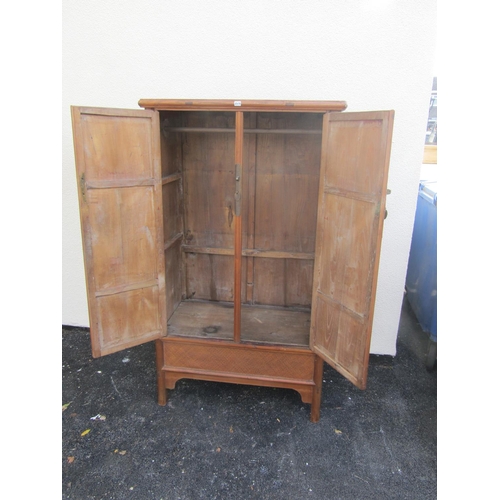 2579 - A Chinese ashwood hanging cupboard, the doors with woven straw work finish over a single frieze draw... 