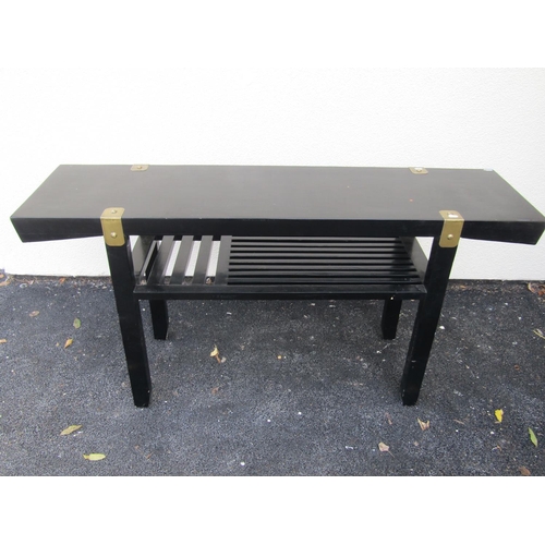 2581a - A Chinese side/serving table with ebonised finish and brass fittings on two tiers, 183 cm long x 40 ... 