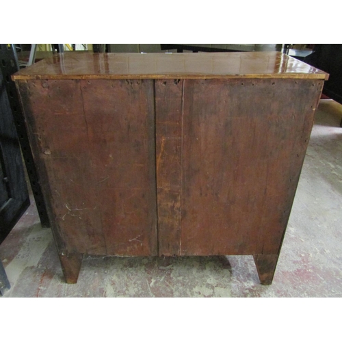 2584 - A Regency mahogany chest of three long and two short drawers with brass plate handles, 106cm wide