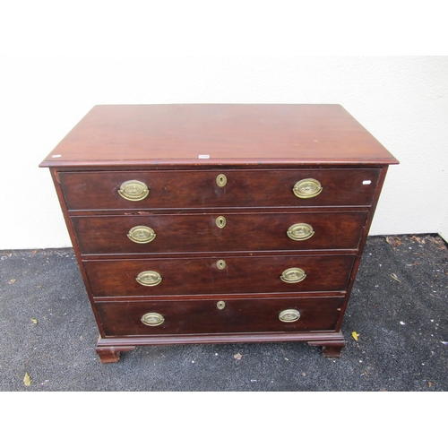 2586 - A Georgian mahogany chest of four long graduated drawers on ogee supports with original brass plate ... 