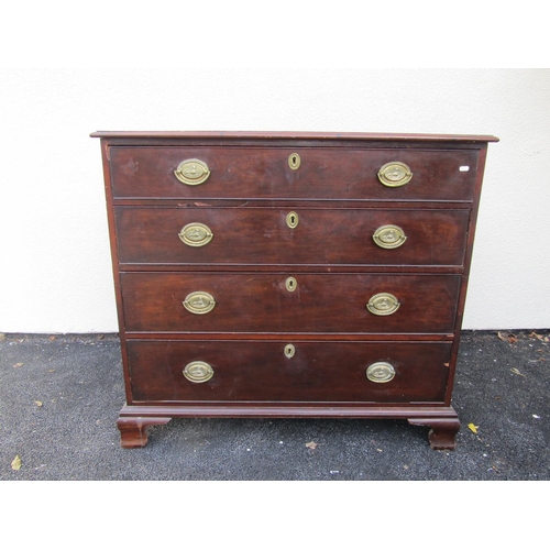 2586 - A Georgian mahogany chest of four long graduated drawers on ogee supports with original brass plate ... 