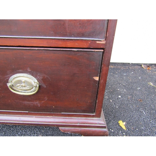 2586 - A Georgian mahogany chest of four long graduated drawers on ogee supports with original brass plate ... 