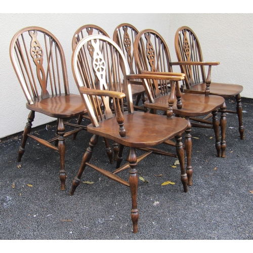 2611 - A set of six (2+4) Windsor wheelback kitchen chairs by Glanister of High Wycombe with elm seats