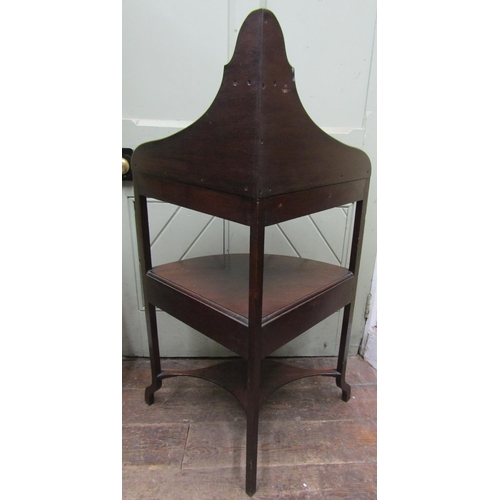 2659 - Georgian mahogany corner wash stand on swept supports