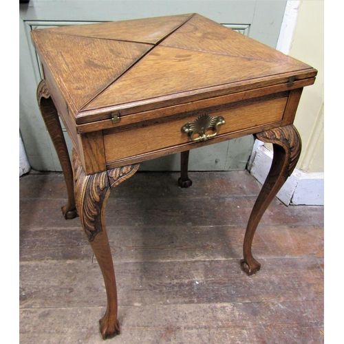 2662 - Edwardian oak envelope card table with frieze drawer, shaped supports and claw and ball feet, 55cm s... 