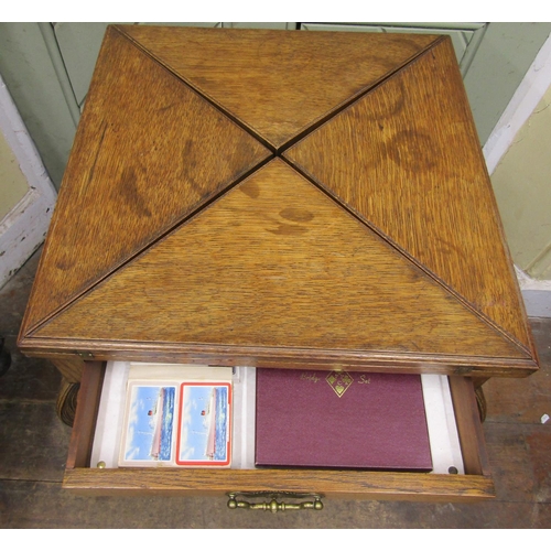 2662 - Edwardian oak envelope card table with frieze drawer, shaped supports and claw and ball feet, 55cm s... 