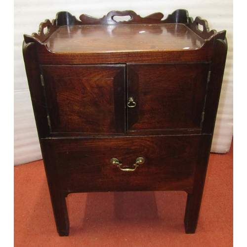 2702 - A Georgian mahogany tray top commode, with two doors and drawer, with a shaped and pierced galleried... 