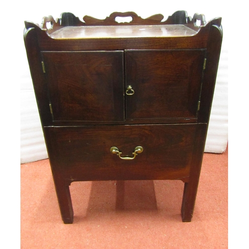 2702 - A Georgian mahogany tray top commode, with two doors and drawer, with a shaped and pierced galleried... 