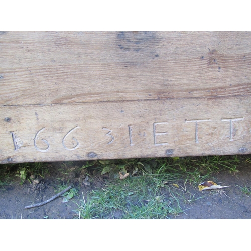 2681 - 17th century boarded coffer dated 1663, initialled I.E.T.T., formerly with two locks, with iron hasp... 