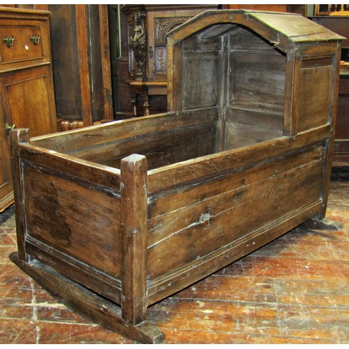 2693 - A substantial Georgian oak rocking cradle, 106cm long