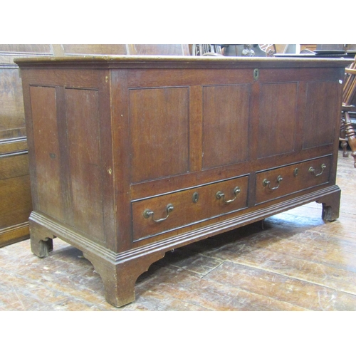 2696 - A Georgian oak mule chest with rising lid, with two frieze drawers, 127cm long