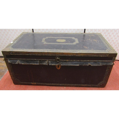 2697 - A Georgian camphor wood travelling chest overlaid in leather with brass borders and stud work detail... 