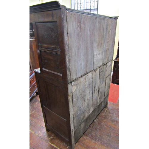 2701 - An old English oak court cupboard, enclosed by three panelled doors, the recessed upper section with... 