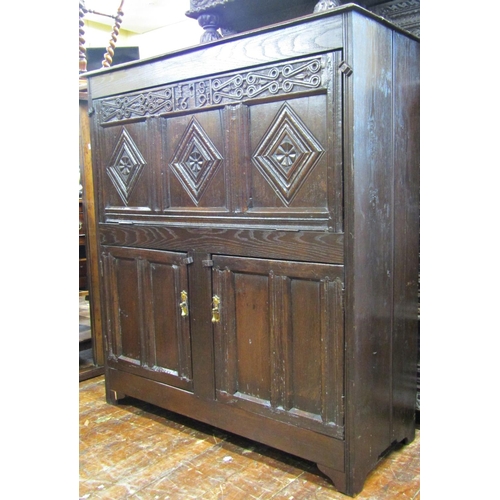 2713 - Old English oak cupboard, the lower section enclosed two panelled doors, the upper section with adap... 