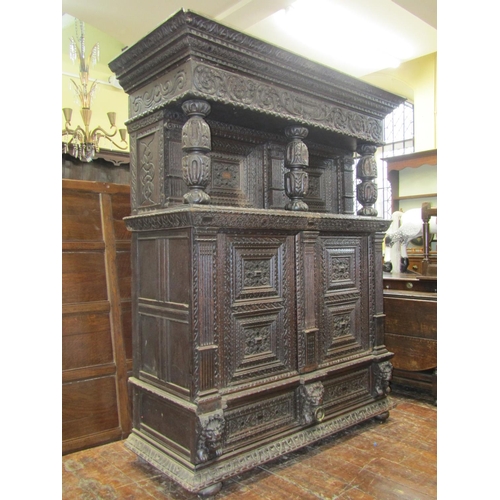 2725 - Substantial oak old English court cupboard with profuse carvings, with two panelled doors and large ... 