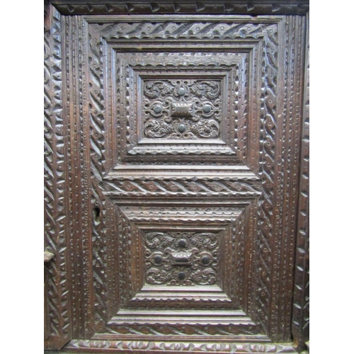 2725 - Substantial oak old English court cupboard with profuse carvings, with two panelled doors and large ... 