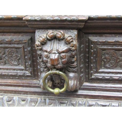 2725 - Substantial oak old English court cupboard with profuse carvings, with two panelled doors and large ... 