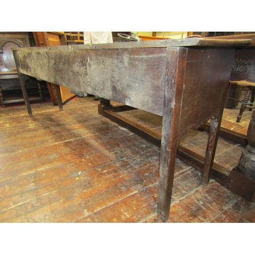 2728 - A Georgian dresser base with three drawers and shaped apron, 220cm long