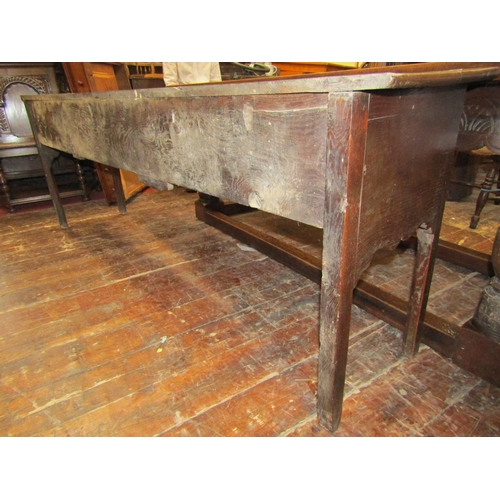 2728 - A Georgian dresser base with three drawers and shaped apron, 220cm long