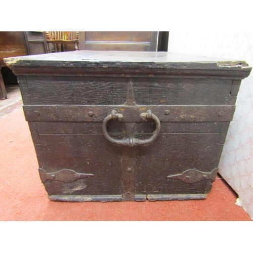 2729 - An early oak and iron bound strong box with carrying handles, 64cm wide x 43cm deep x 33cm high