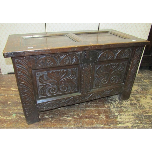 2734 - A small 18th century panelled oak coffer with repeating geometric carved detail, 89cm long x 44cm de... 