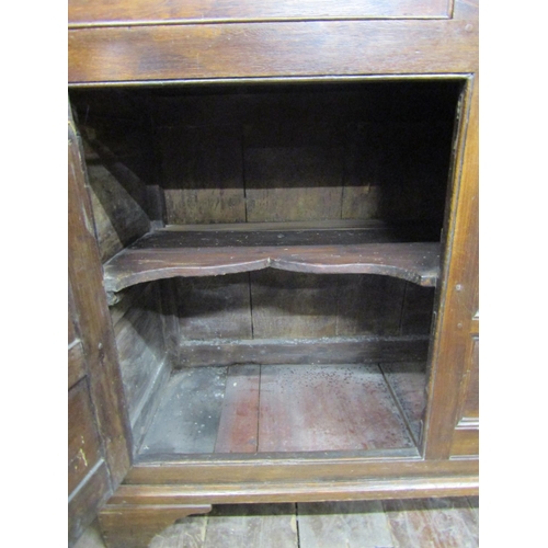 2746 - Regency oak dresser enclosed by two cupboards and three drawers, with ogee moulded outline, the boar... 