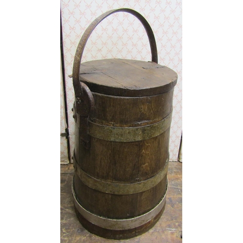 2747 - A cylindrical tapering coopered oak barrel and cover with steel bands, 48cm high