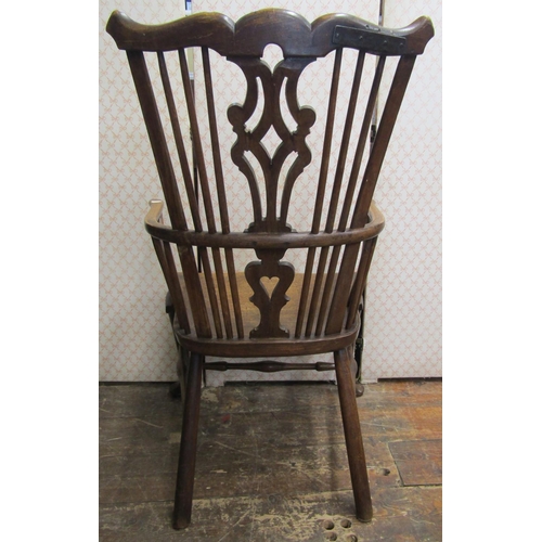 2748 - An 18th century Windsor elbow chair, principally in elm and fruit wood, with dished seat and shaped ... 