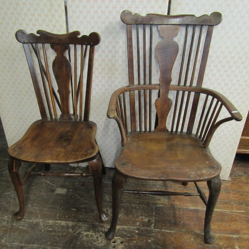 2751 - A carefully matched set of four (3+1) Georgian Windsor chairs principally in elm and other mixed woo... 