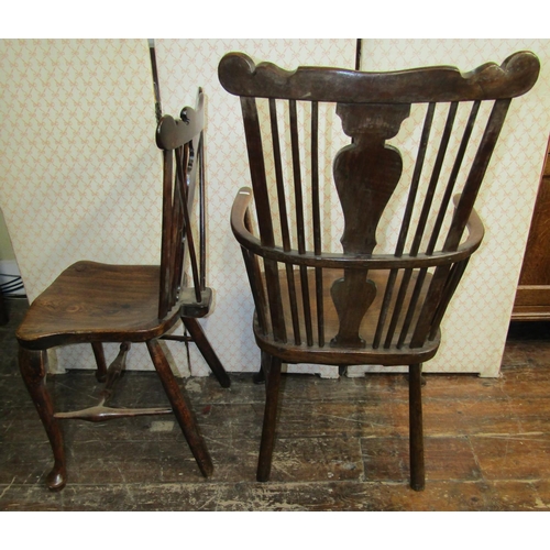 2751 - A carefully matched set of four (3+1) Georgian Windsor chairs principally in elm and other mixed woo... 