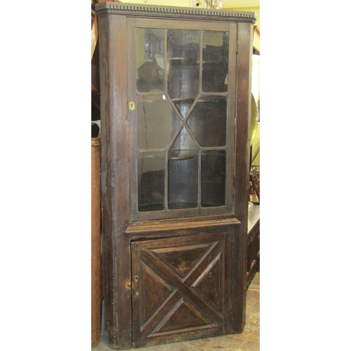 2756 - A Georgian and later oak barrel back freestanding corner cupboard, lower section with quarter panell... 