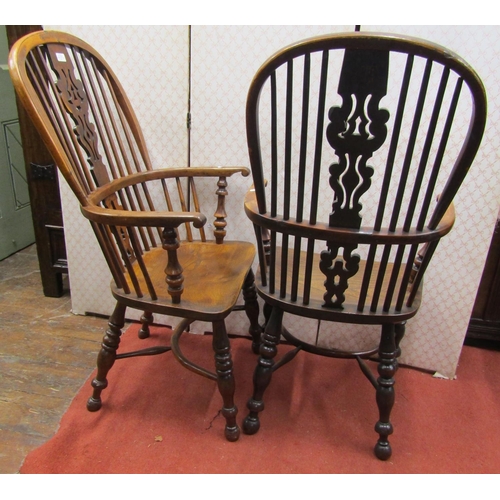 2765 - An almost identical matched pair of Georgian Windsor comb back elbow chairs in elm and yew wood, wit... 