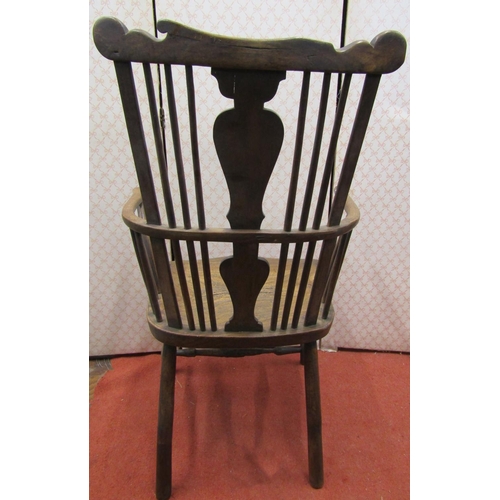 2768 - 18th century Windsor stick back elbow chair in elm and other woods with vase shaped splat