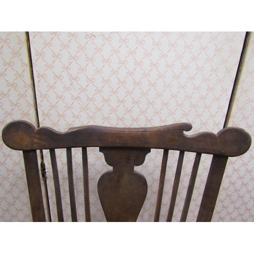 2768 - 18th century Windsor stick back elbow chair in elm and other woods with vase shaped splat