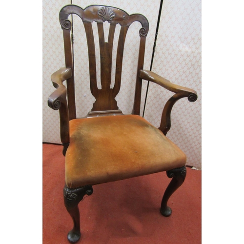 2769 - A Georgian  elbow chair with shaped cresting rail and pierced splat, shell and scroll carving and up... 