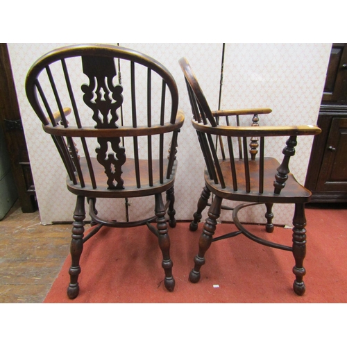 2770 - A pair of Georgian Windsor low comb back elbow chairs in elm and yew wood, with Christmas tree patte... 