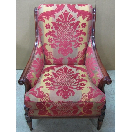 2346 - A Wesley-Barrell upholstered armchair in the Regency style, with scrolled show wood frame raised on ... 