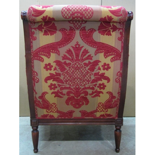 2346 - A Wesley-Barrell upholstered armchair in the Regency style, with scrolled show wood frame raised on ... 