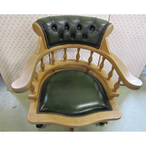 2348 - A reproduction swivel captains style office desk chair with green leather upholstered pad seat and b... 