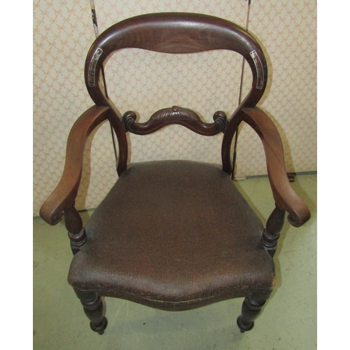 2357 - A 19th century mahogany balloon back carver chair with scrolled moustache splat over a rexine uphols... 