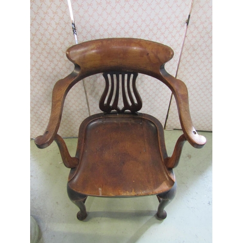 2368 - A 19th century mahogany office desk chair with open shaped arms, saddle seat, labelled Hewteston, Mi... 