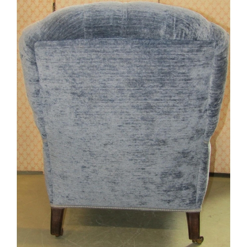 2369 - A Victorian low deep seated open arm chair, upholstered seat, button back and swept arms, the suppor... 