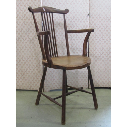 2378 - An Edwardian stick back open elbow chair with circular dished seat