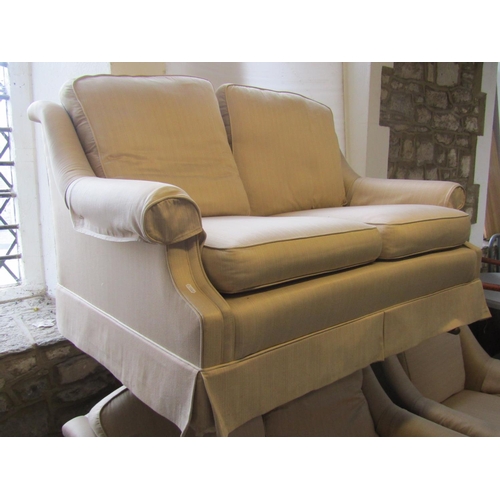 2383 - A pair of two seat sofas, 136cm wide and a matching armchair (3)