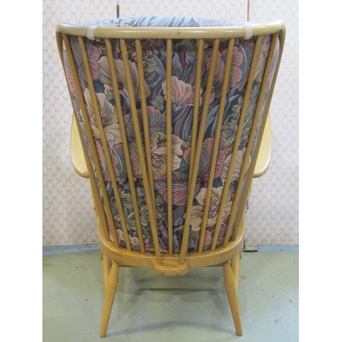 2390 - A pair of vintage Ercol light beechwood Windsor style high stick back open arm chairs with loose cus... 