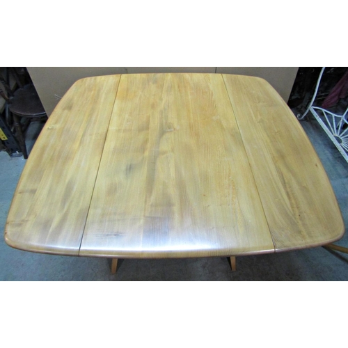 2392 - A vintage Ercol light elm and beechwood drop leaf dining table, with splayed supports, 110cm x 120cm... 