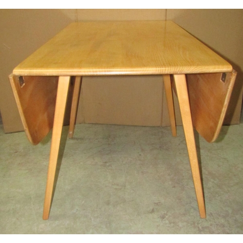 2392 - A vintage Ercol light elm and beechwood drop leaf dining table, with splayed supports, 110cm x 120cm... 